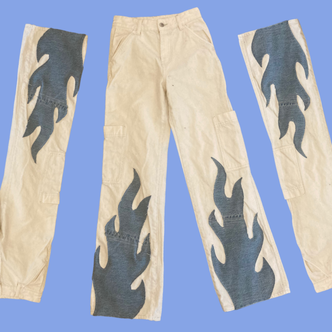 A pair of jeans with flames on them.