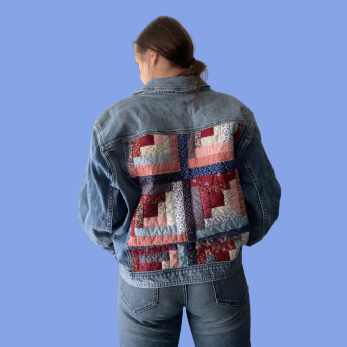 A woman wearing a quilted denim jacket.