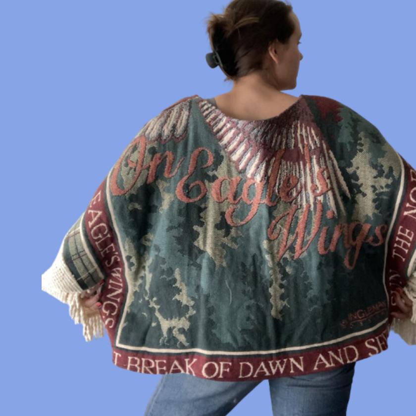 In eagle's wings poncho.