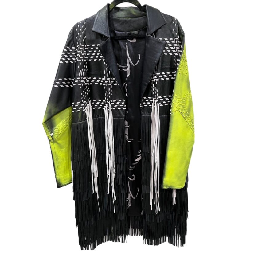 A black and yellow fringed jacket hanging on a hanger.