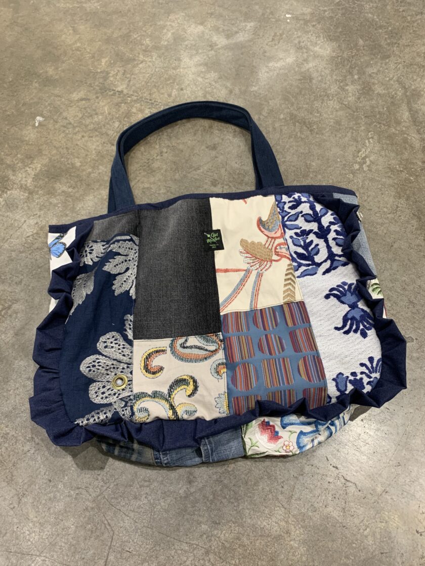 A blue and white patchwork bag.