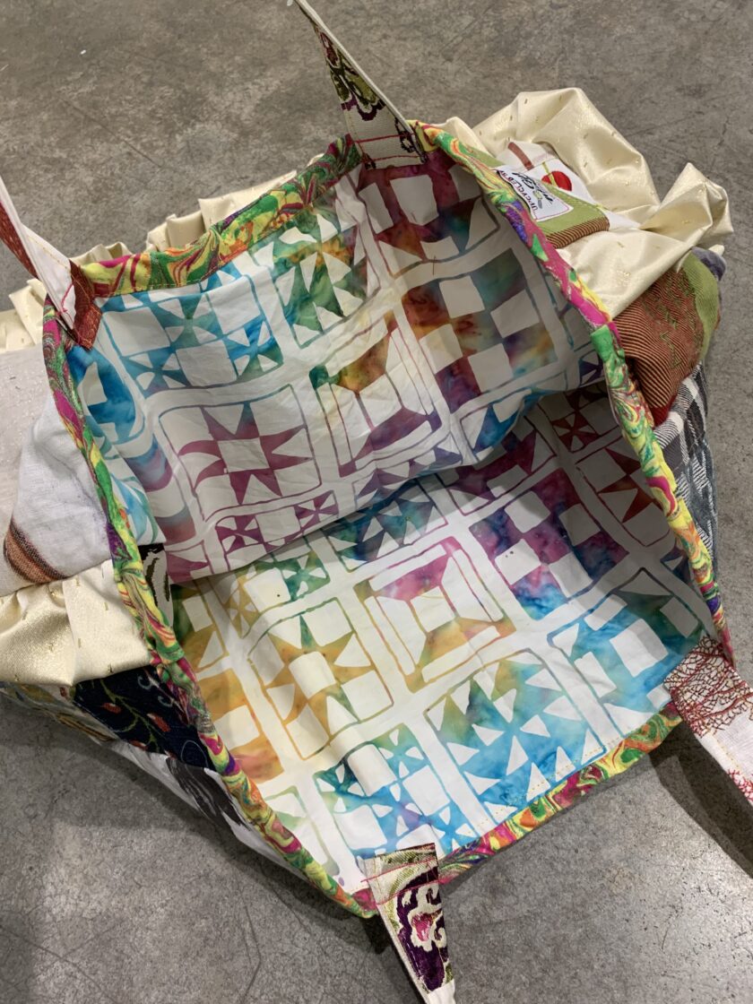 A fabric bag with colorful designs.