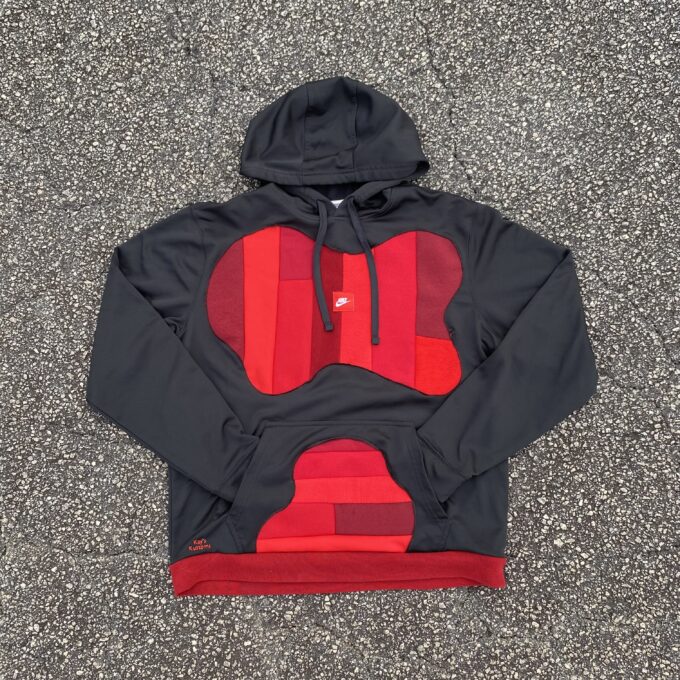 A black and red hoodie with a heart on it.