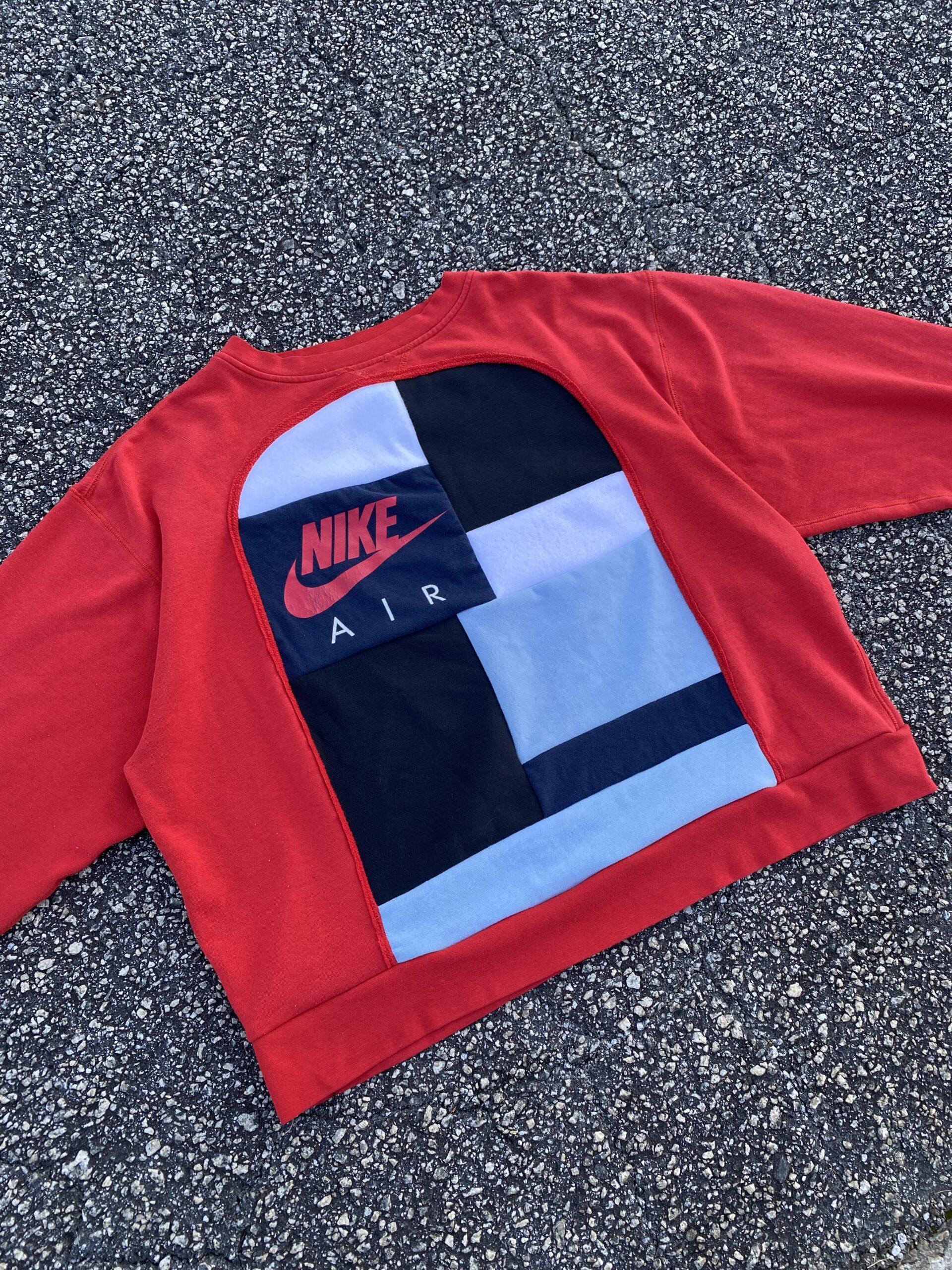 Red nike air cropped sweatshirt.