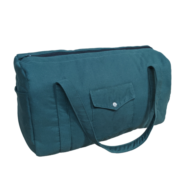 A teal tote bag on a black background.