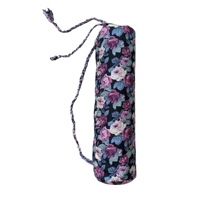 A yoga bag with purple and blue flowers on it.