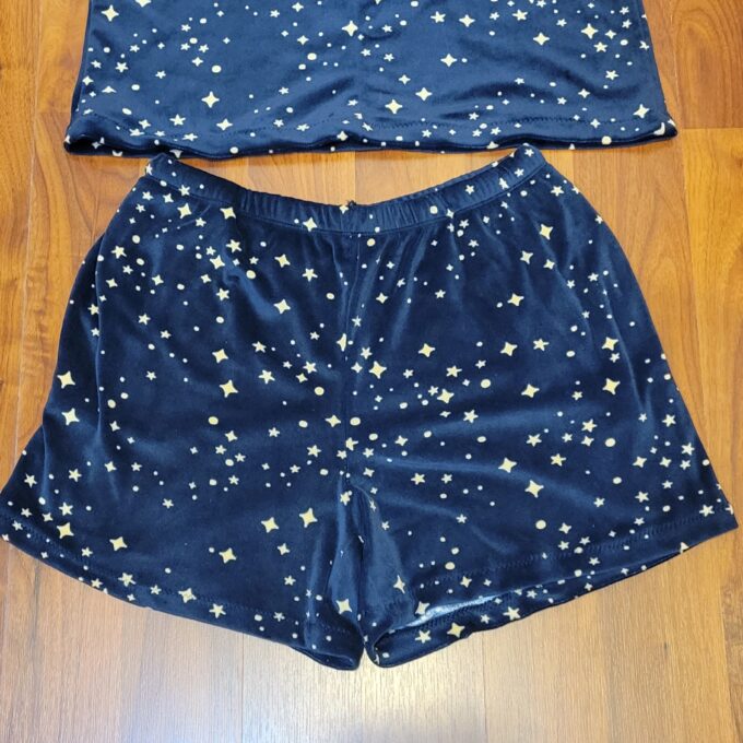 A pair of blue shorts with white stars on it.