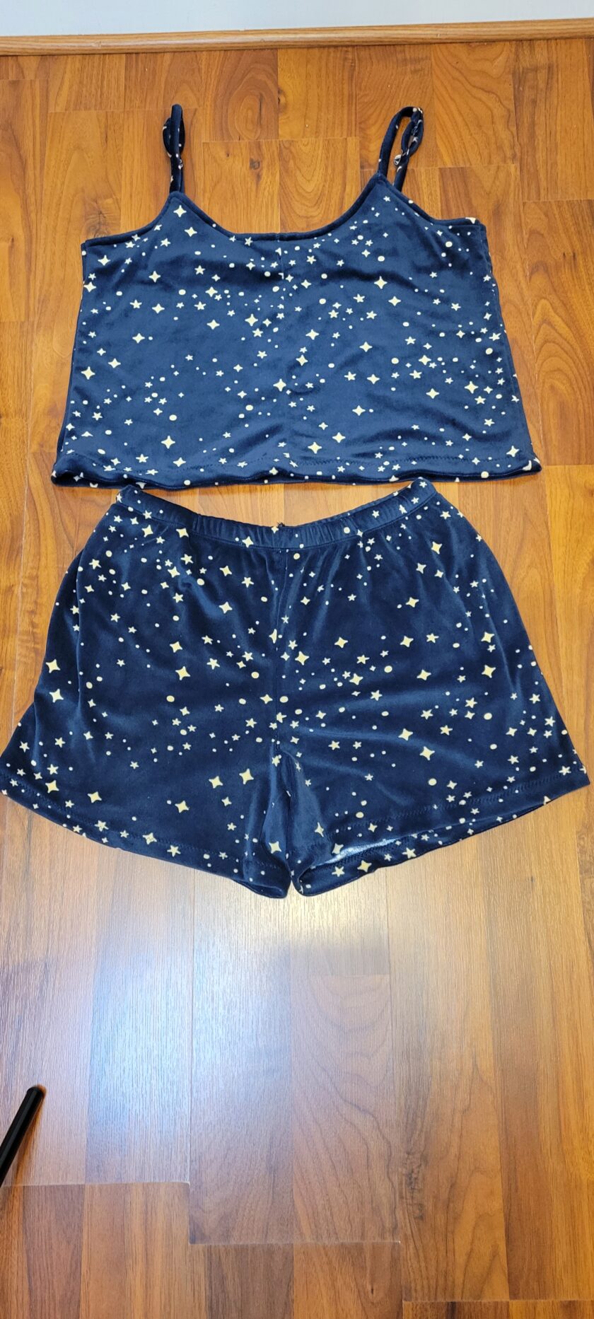 A pair of blue shorts with white stars on it.