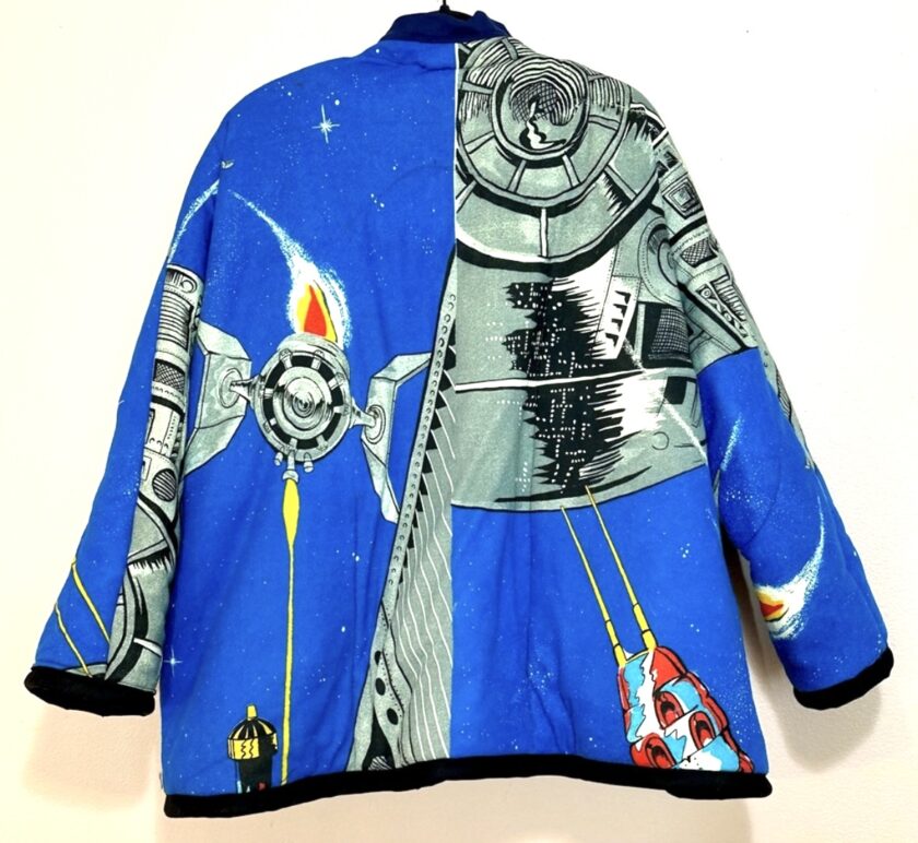 A blue jacket with a spaceship on it.