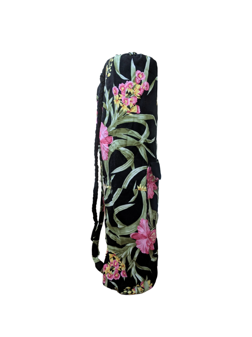 A black yoga bag with pink flowers on it.