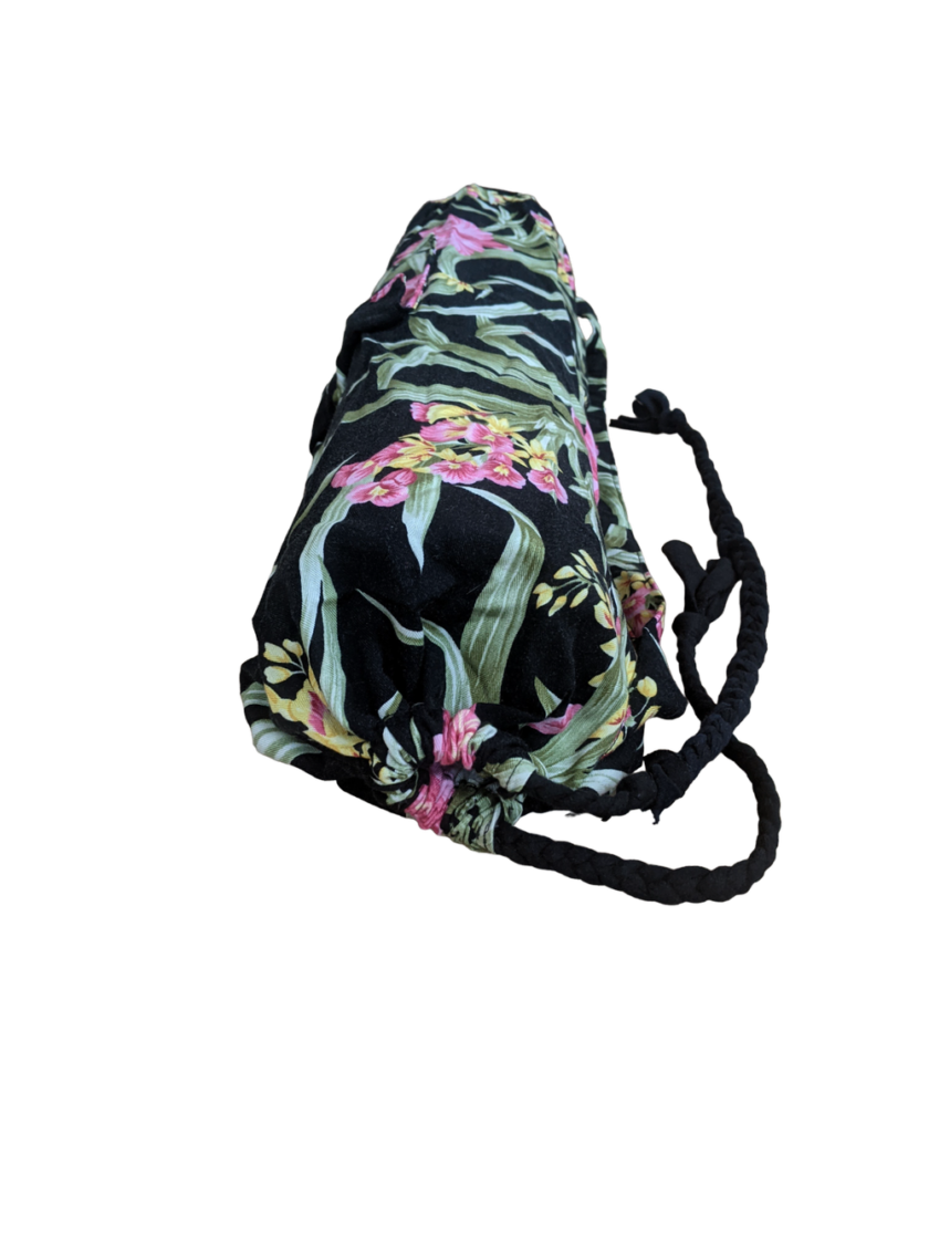 A black bag with a flower print on it.