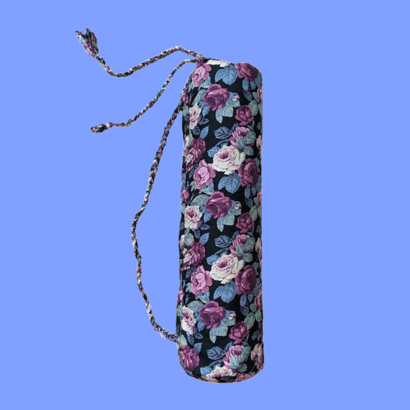 A yoga mat with a floral pattern on it.