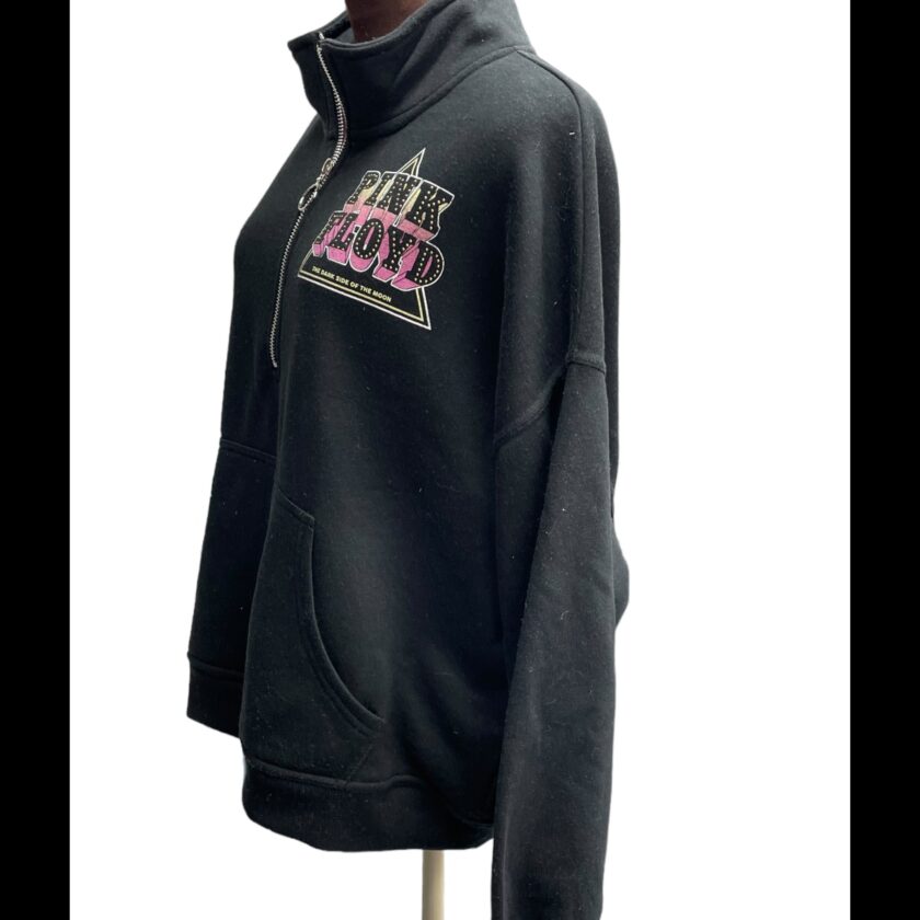 A black sweatshirt with a pink logo on it.