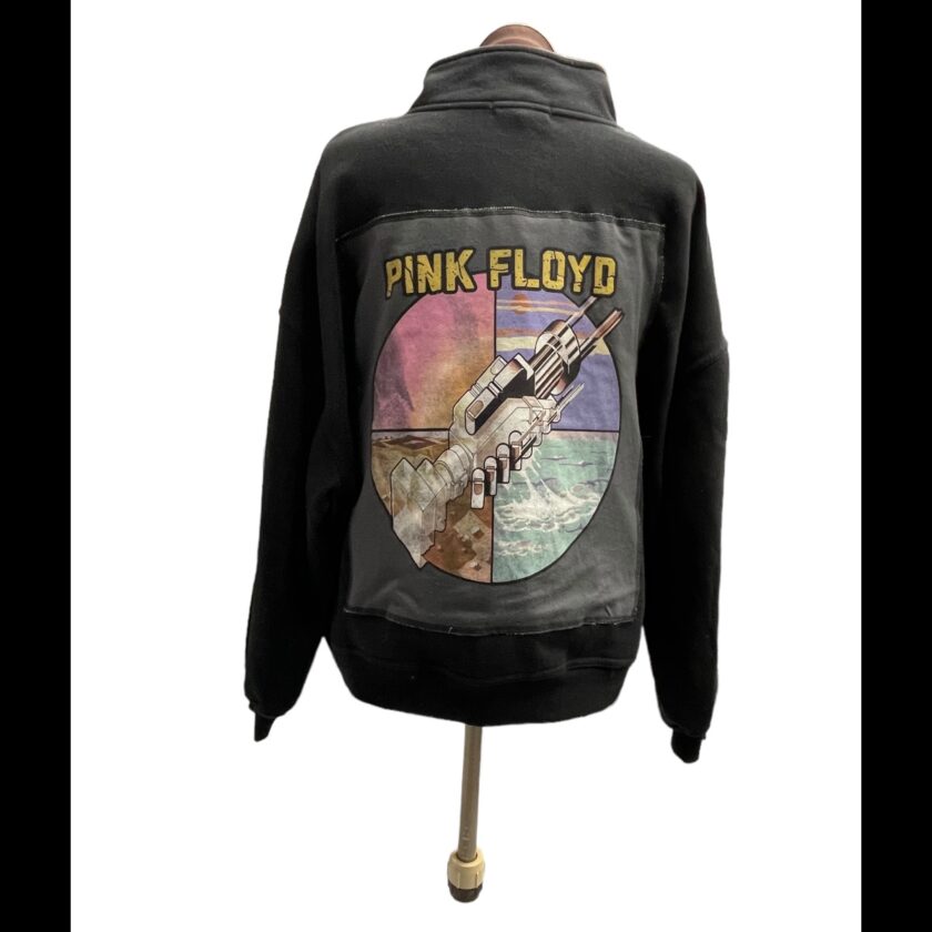 A pink floyd hoodie with an image of a spaceship.