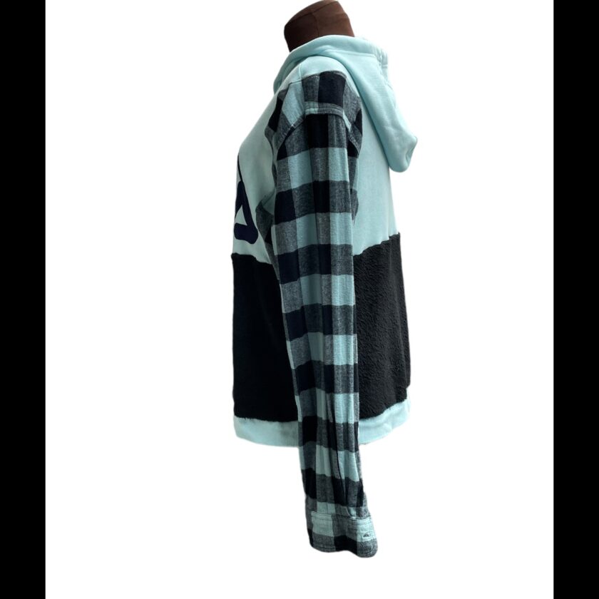 A mannequin wearing a blue and black plaid hoodie.