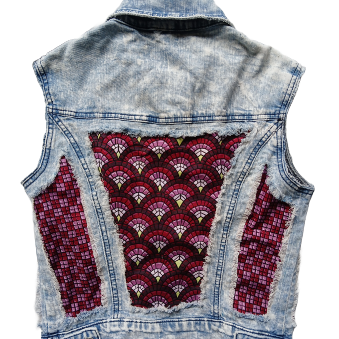 A raw denim upcycled vest with art deco fabric panels