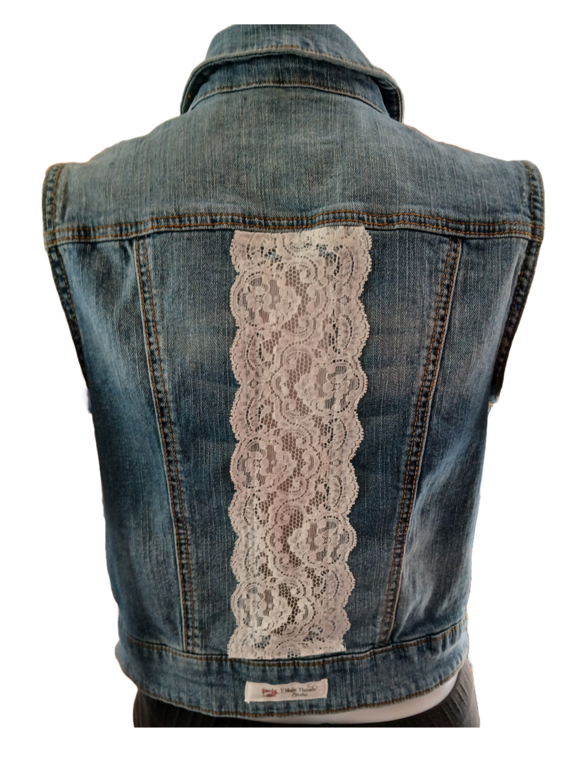 A boho denim vest with lace panel down the back