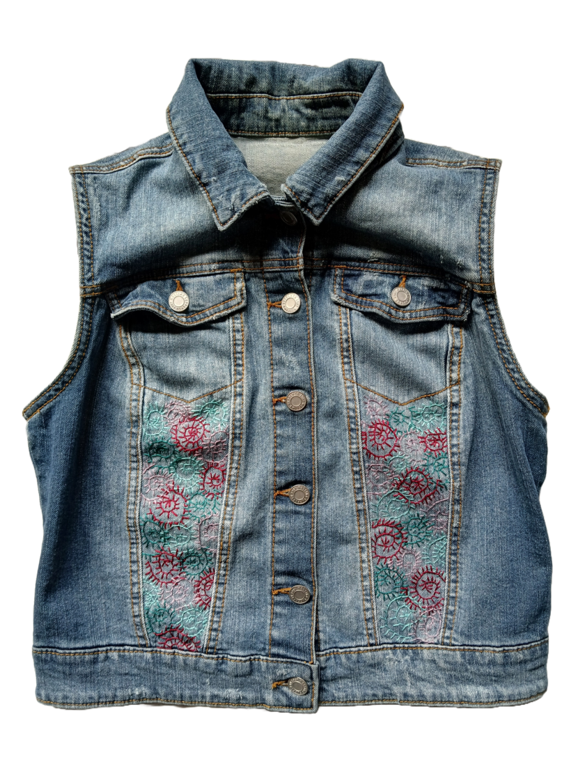 Embroidery spirals on an upcycled denim vest