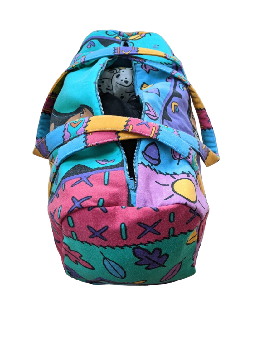 A colorful bag with a cartoon character inside.