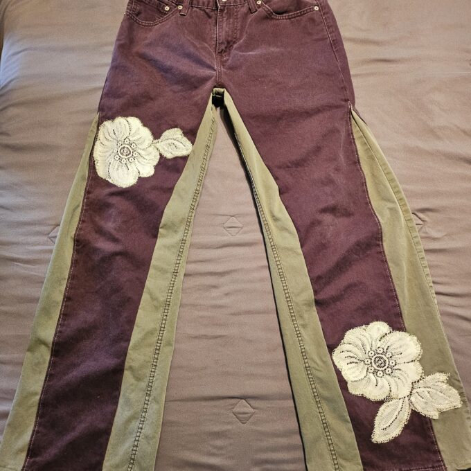 Embroidered women's pants with contrasting side stripes.