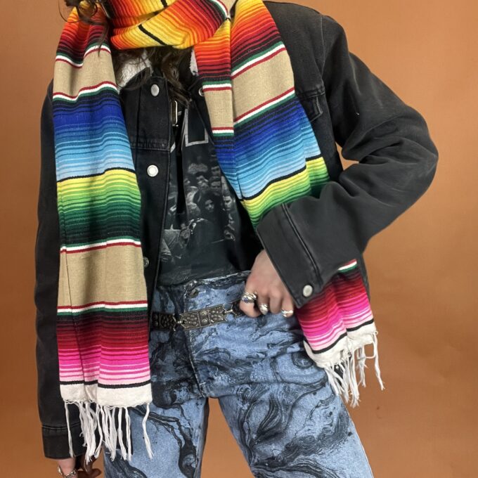 A person wearing a colorful scarf.