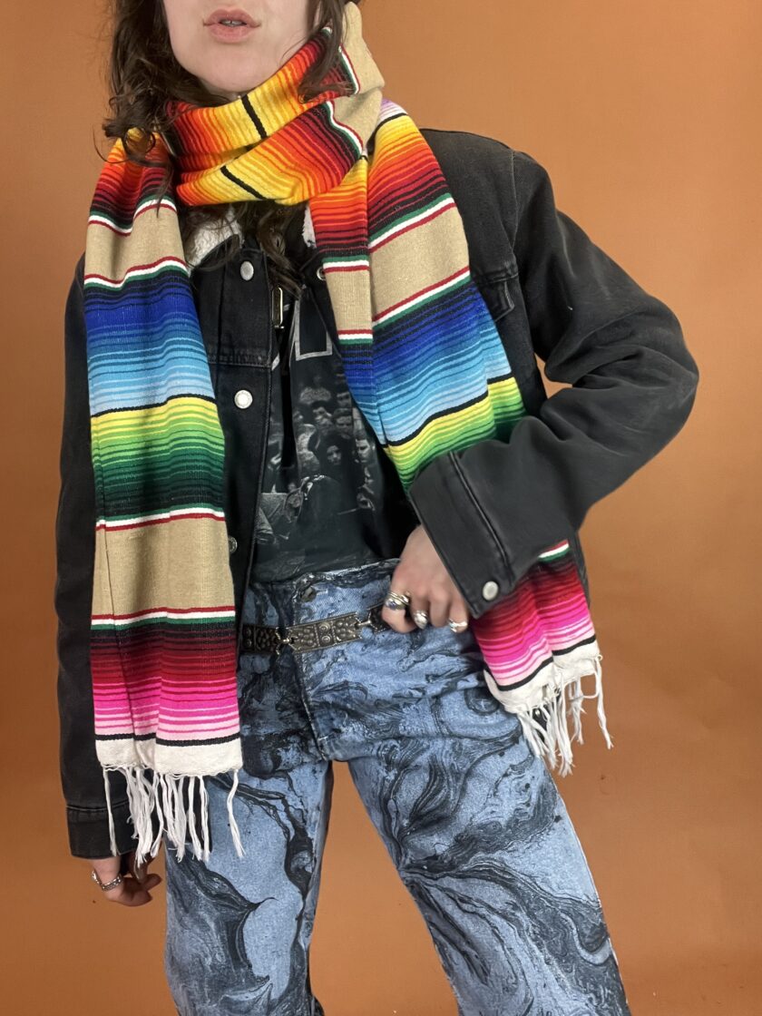 A person wearing a colorful scarf.