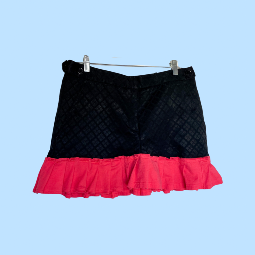 A black and coral skirt with ruffles.