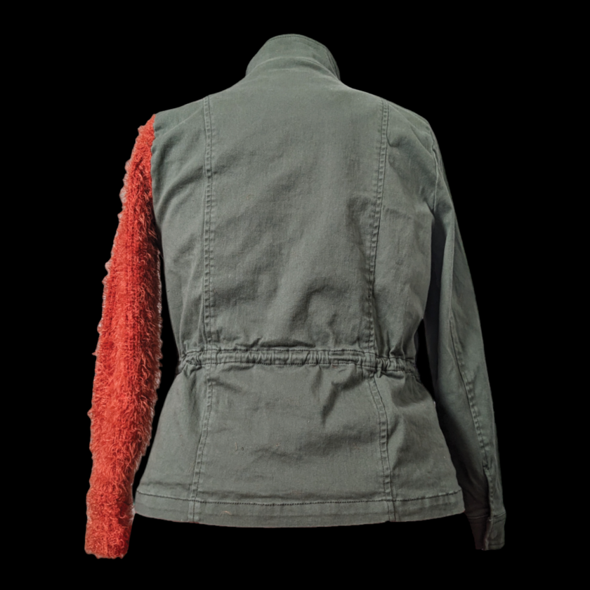 A jacket with a red sleeve.