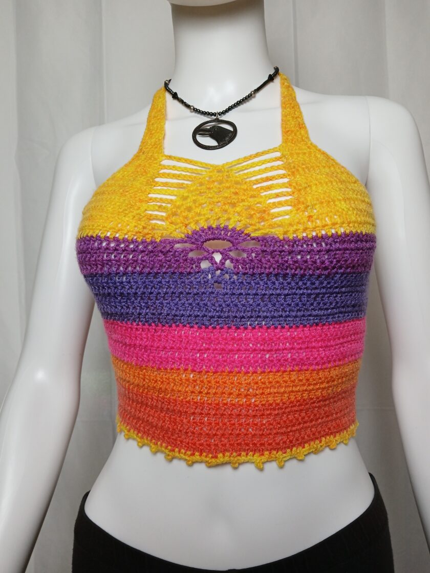 A rainbow crochet rave top with pineapple designhet