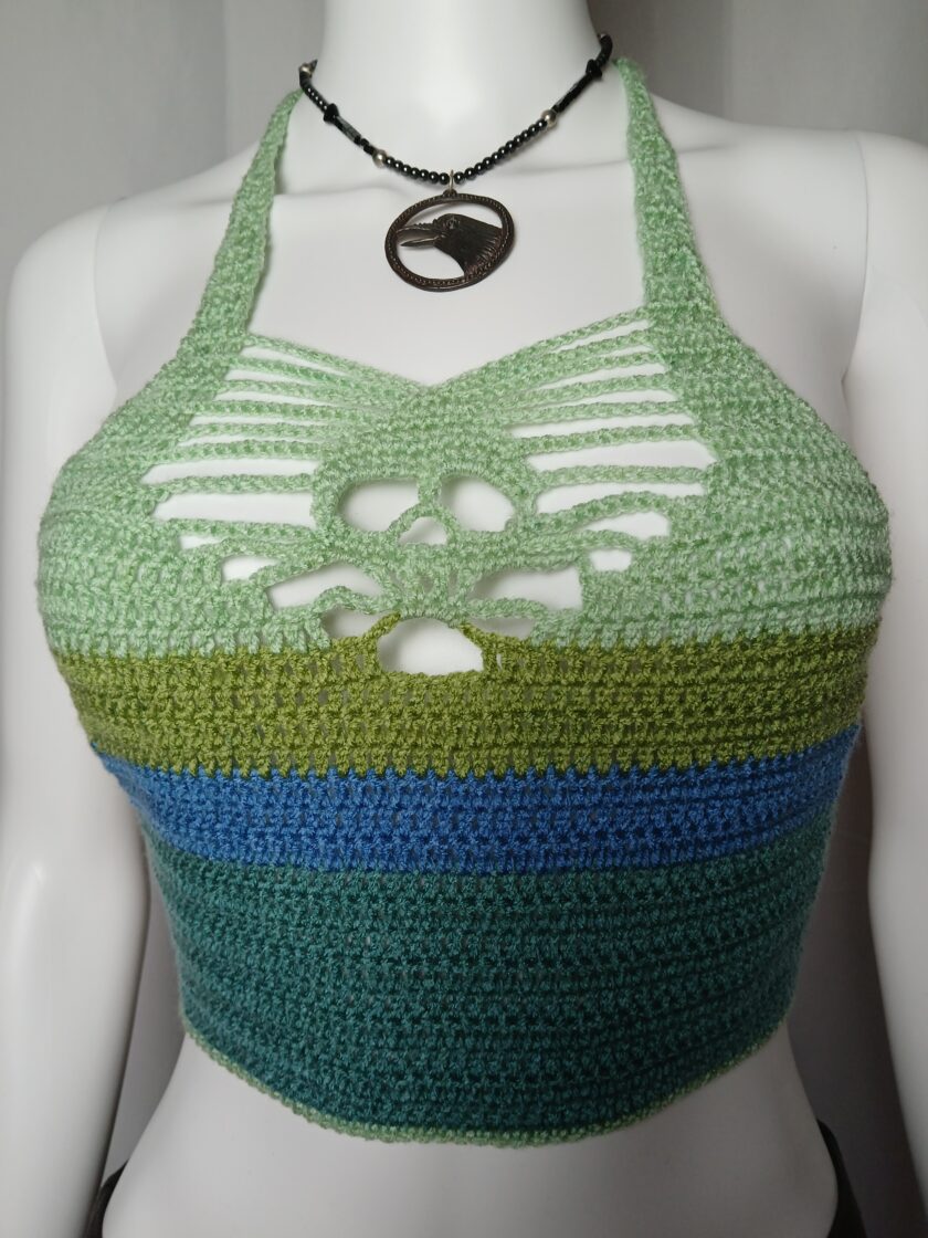 A green and blue crocheted skull top made from reclaimed yarn