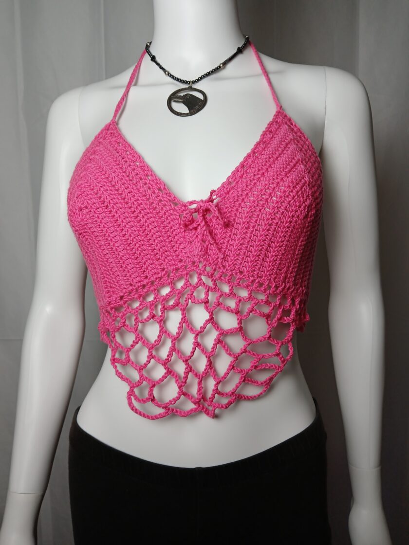 Belly dancer style hot pink crochet halter top on a mannequin