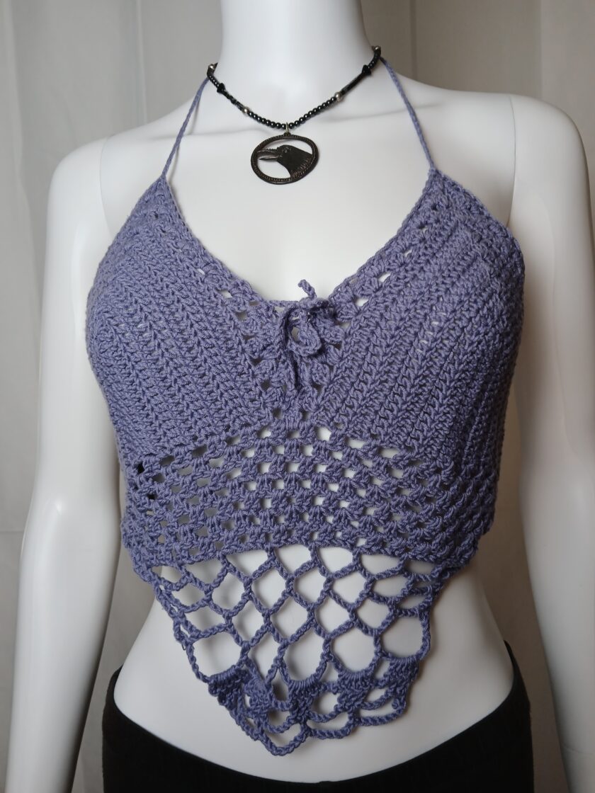 Purple crochet halter with cropped length on a mannequin
