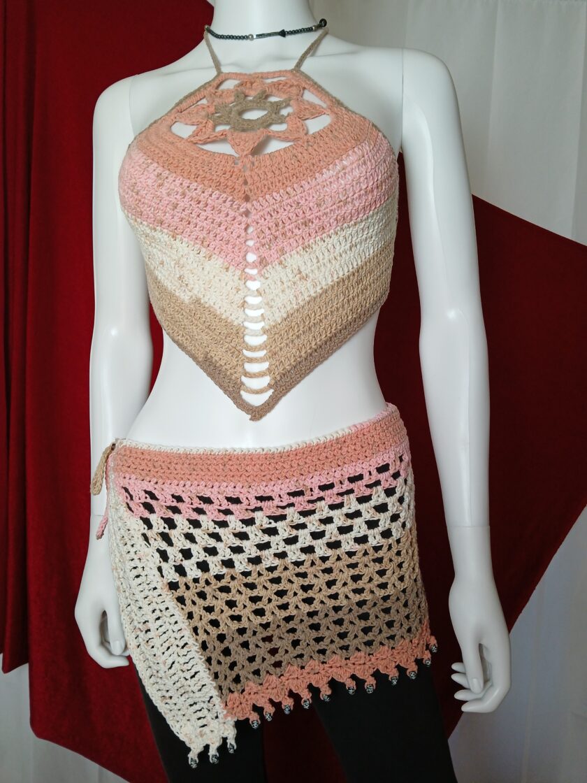 A handmade crocheted lotus flower halter top and beaded hip scarf skirt in ice cream shades.