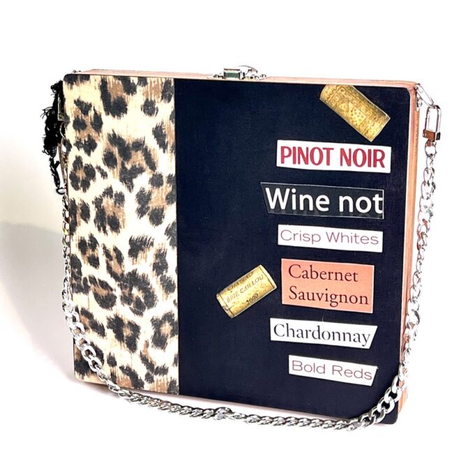 Square wood cigar box purse with cheetah print and wine words cut-out from magazines.